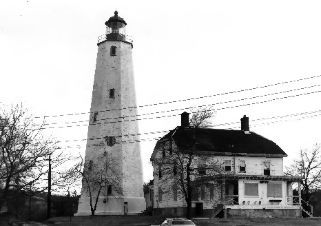 Sandy Hook Lighthouse, Sandy Hook New Jersey 1975 West elevation of Sandy Hook Light, Coast Guards quarters to the left