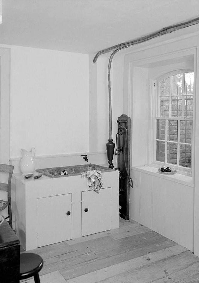 Lindenwald Mansion - Martin Van Buren House, Kinderhook New York INTERIOR, BASEMENT, VIEW OF THE WEST CORNER OF ROOM 006 SHOWING THE LEAD SINK, PIPES, AND PUMP