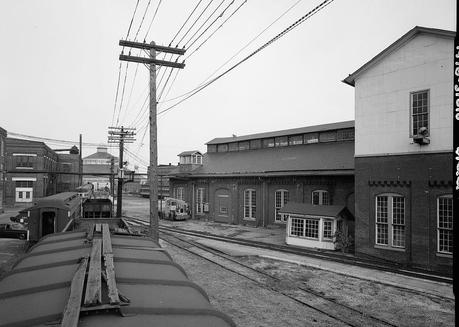 Baltimore & Ohio Railroad, Mount Clare Shops, Baltimore Maryland BOILER SHOP FROM TOP OF BOX CAR WITH CIRCULAR CAR SHOP IN BACKGROUND LOOKING NORTHEAST (1976)