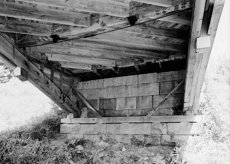 Barrackville Covered Bridge West Virginia NORTH ABUTMENT. NOTE RAILROAD STIFFENERS, TRUNNELS, AND DIAGONAL FLOOR BEAMS WITH DIAGONAL FLOORING. 